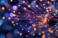 Abstract fiber optic light trails with glowing bokeh effects creating dynamic energy burst pattern for technology and communication backgrounds.