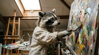 Raccoon artist wearing apron painting colorful artwork on canvas in bright art studio with easel and creative supplies.
