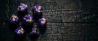 Purple polyhedral dice with gold numbers arranged on dark textured surface, suitable for tabletop gaming, role-playing games, and fantasy entertainment design projects.