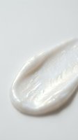 Creamy white cosmetic product swatch with pearlescent shimmer and smooth texture, isolated on neutral background for skincare, makeup, and beauty design applications.