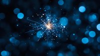 Glowing sparkler emitting bright sparks against dark background with blue bokeh lights creating magical festive atmosphere. Great for holiday designs.