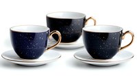 Elegant navy blue teacups with gold handles and starry night sky pattern on white saucers, arranged in minimalist composition against white background.