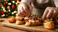 Chef preparing festive holiday appetizers with cranberries and herbs on wooden board with Christmas tree lights creating warm bokeh background atmosphere.