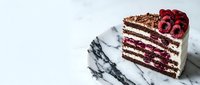 Chocolate layer cake slice with cherry filling and fresh raspberries on marble plate, gourmet dessert for bakery menu and food photography.