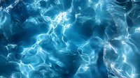 Luminous blue water surface with sunlight reflections creating abstract rippling patterns and waves. Tranquil aquatic background for nature themes.