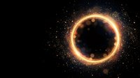 Glowing golden ring portal with sparkling particles on black background for sci-fi fantasy designs and cosmic themed projects.