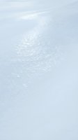 Calm ocean water surface with gentle ripples and soft sunlight reflections creating peaceful seascape background for meditation and wellness content.
