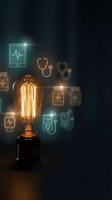 Vintage Edison bulb with glowing medical technology icons including stethoscope, tablets, and health monitoring devices on dark background.