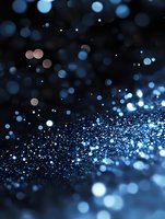 Magical blue glowing particles and bokeh lights scattered on dark background create dreamy atmosphere for festive designs and holiday projects.