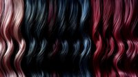 Colorful wavy hair strands in pink, blue, black, and red tones creating a vibrant pattern of curls for salon advertising and beauty industry use.
