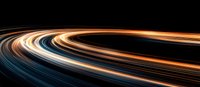 Dynamic light trails curve across dark background creating futuristic motion effect in orange, blue and white colors, abstract long exposure photography style composition.