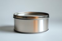 Round metal tin container with silver metallic finish and secure lid on white background, suitable for packaging design and product mockups.