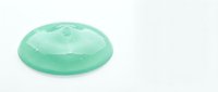 Green translucent oval gemstone with smooth polished surface isolated on white background for jewelry design and luxury accessories.