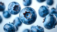 Fresh ripe blueberries floating on white background, organic superfood berries for healthy eating, nutrition and diet concepts.