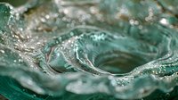 Mesmerizing turquoise water splash frozen in time creates abstract circular patterns with dynamic movement and crystalline droplets, suitable for creative backgrounds.