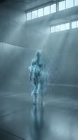 Ethereal figure dissolving into particles in minimalist concrete interior with dramatic light rays streaming through windows, conveying transformation and digital abstraction.