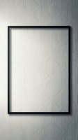 Black rectangular frame mockup on geometric patterned wall, empty canvas for artwork or poster display in modern interior.