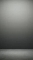 Minimalist empty studio space with dark gradient wall and concrete floor, suitable for product photography, backdrop design, and commercial advertising layouts.