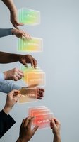 Multiple hands stacking glowing neon data classification cards labeled public, internal, restricted, confidential, and top secret, representing information security levels and access control hierarchy.