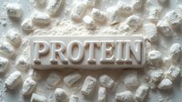 White protein powder scattered on light surface with embossed text. Nutritional supplement and fitness concept for sports nutrition and bodybuilding.
