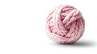 Pink wool yarn ball twisted in decorative knot pattern on white background, soft pastel color merino fiber for knitting and crafts, isolated with copy space.