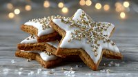 Star-shaped gingerbread cookies with white icing and gold sprinkles on wooden surface, festive bokeh lights in background for holiday celebrations.