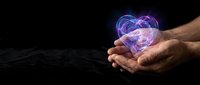 Male hands cupping glowing purple heart with energy waves on dark background for love, care, healing, wellness, spiritual and romantic concepts.