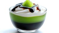 Layered green tea dessert with whipped cream and chocolate sauce in glass bowl isolated on white background for culinary design and menu presentation.