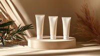 White cosmetic tubes on beige podium with palm leaves and pampas grass in warm sunlight and shadows. Natural beauty product presentation.