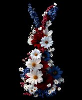 Patriotic floral arrangement in shape of bunny silhouette featuring white daisies, red and blue flowers against black background, creating festive holiday display.