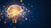 Creative brain lightbulb glowing with neural networks and bokeh lights on dark blue background representing innovation, ideas, creativity and intelligence.