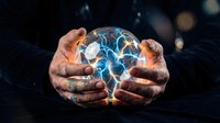 Man holding glowing crystal ball with electric blue energy, symbolizing future prediction, technology innovation, and mystical power for business concepts.
