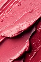 Pink lipstick smear texture with creamy smooth strokes for beauty cosmetics makeup advertising and fashion design projects.