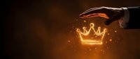Gloved hand presenting glowing golden crown symbol with sparkling light particles on dark background for success and leadership concepts.