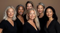 Diverse group of women wearing black v-neck tops against brown background, representing beauty, aging gracefully and inclusivity in fashion and lifestyle industry.