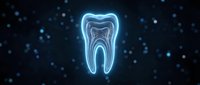 Glowing neon tooth icon with blue light effect on dark background with bokeh particles for dental care and oral health concepts.