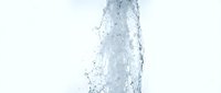 Clear water splash with droplets and bubbles against white background for refreshing beverage and hydration concepts in commercial design projects.