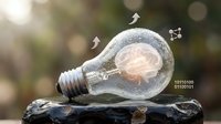 Light bulb with glowing brain inside and floating arrows symbolizing innovation, creativity, and business growth ideas for corporate design projects.