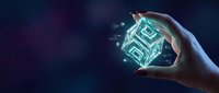 Hand holding a glowing digital cube with circuit patterns on dark blue background, symbolizing technology, innovation, and data management.