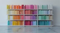 Modern bookshelf with color-coordinated books arranged in rainbow spectrum order, perfect for interior design, library decoration, and minimalist home organization concepts.