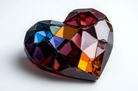 Multicolored geometric crystal heart with faceted surface reflecting blue, purple, red and amber tones on white background, suitable for jewelry and valentine designs.