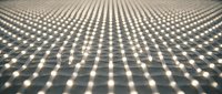 Rows of glowing LED lights arranged in a precise grid pattern on a textured surface, creating a futuristic luminous display with depth and perspective.