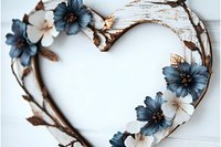 Rustic heart-shaped wreath with blue and white flowers on white wooden background for romantic home decor and craft projects.