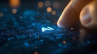 Finger touching glowing AI text on digital circuit board with blue technology background and bokeh lights, representing artificial intelligence concept.