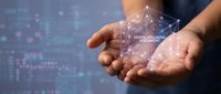 Businessman hands holding glowing digital brain with neural network connections representing artificial intelligence and machine learning technology.