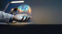 Businessman hand holding glowing globe sphere with digital earth map, representing global business, technology innovation, and worldwide connectivity for corporate concepts.