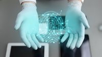 Healthcare professional in medical gloves presenting digital fingerprint hologram for biometric security and identity verification technology applications.