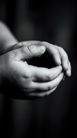 Cupped hands in black and white photography showing protective gesture and care concept for meditation, prayer, and spiritual wellness themes.