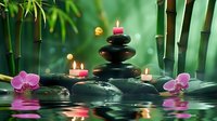 Zen spa composition with stacked black stones, lit candles, pink orchid flowers and bamboo creating peaceful meditation atmosphere for wellness relaxation.
