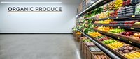 Modern grocery store organic produce section with fresh fruits and vegetables displayed on wooden shelves under bright lighting for healthy shopping.